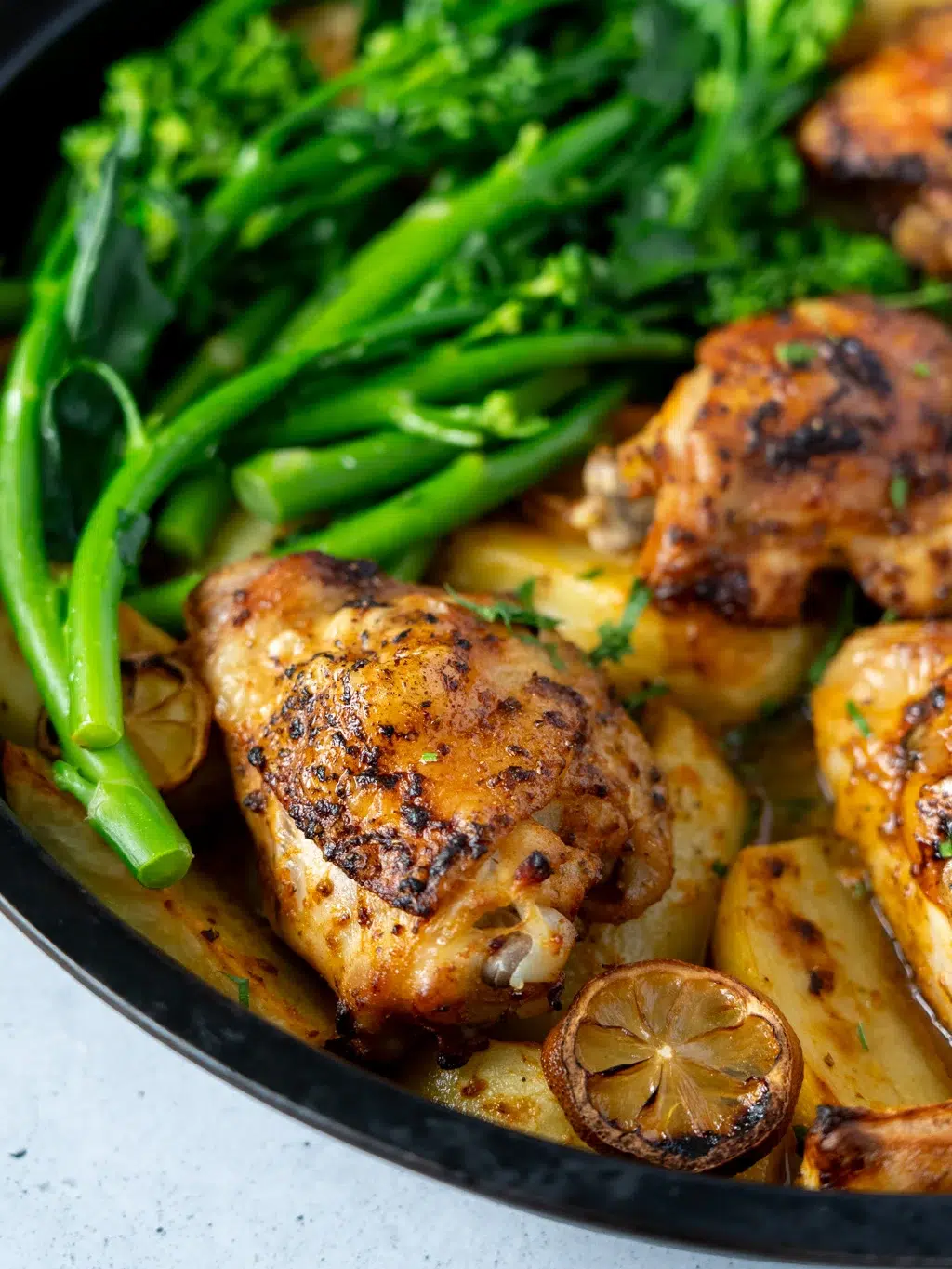 lemony chicken thighs with potatoes in a single skillet