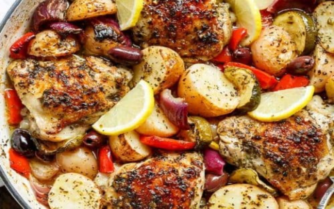 lemony chicken thighs with potatoes in a single skillet