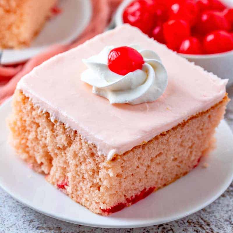 white cake mix dessert with maraschino cherries