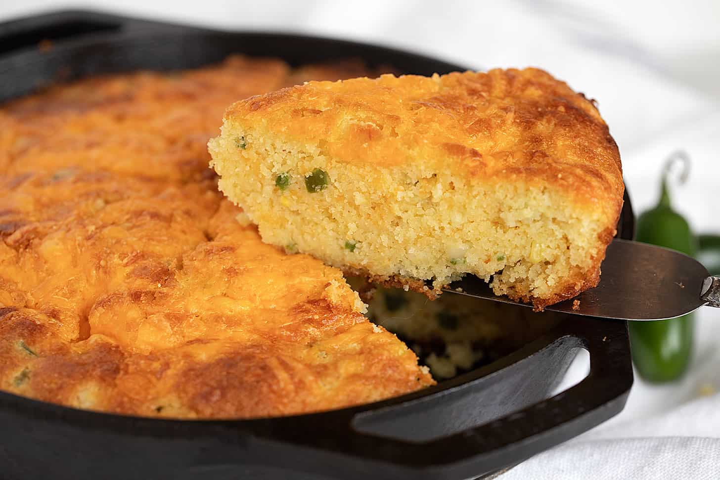 crispy jalapeno cornbread baked in a cast iron pan