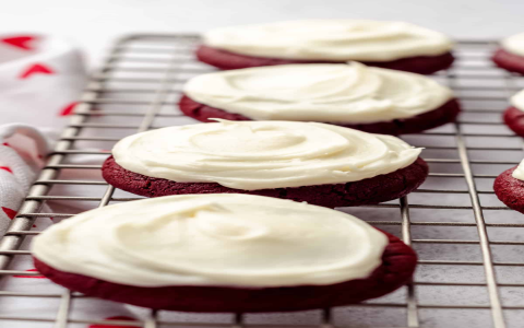 chocolate chip pumpkin cookies topped with cream cheese frosting
