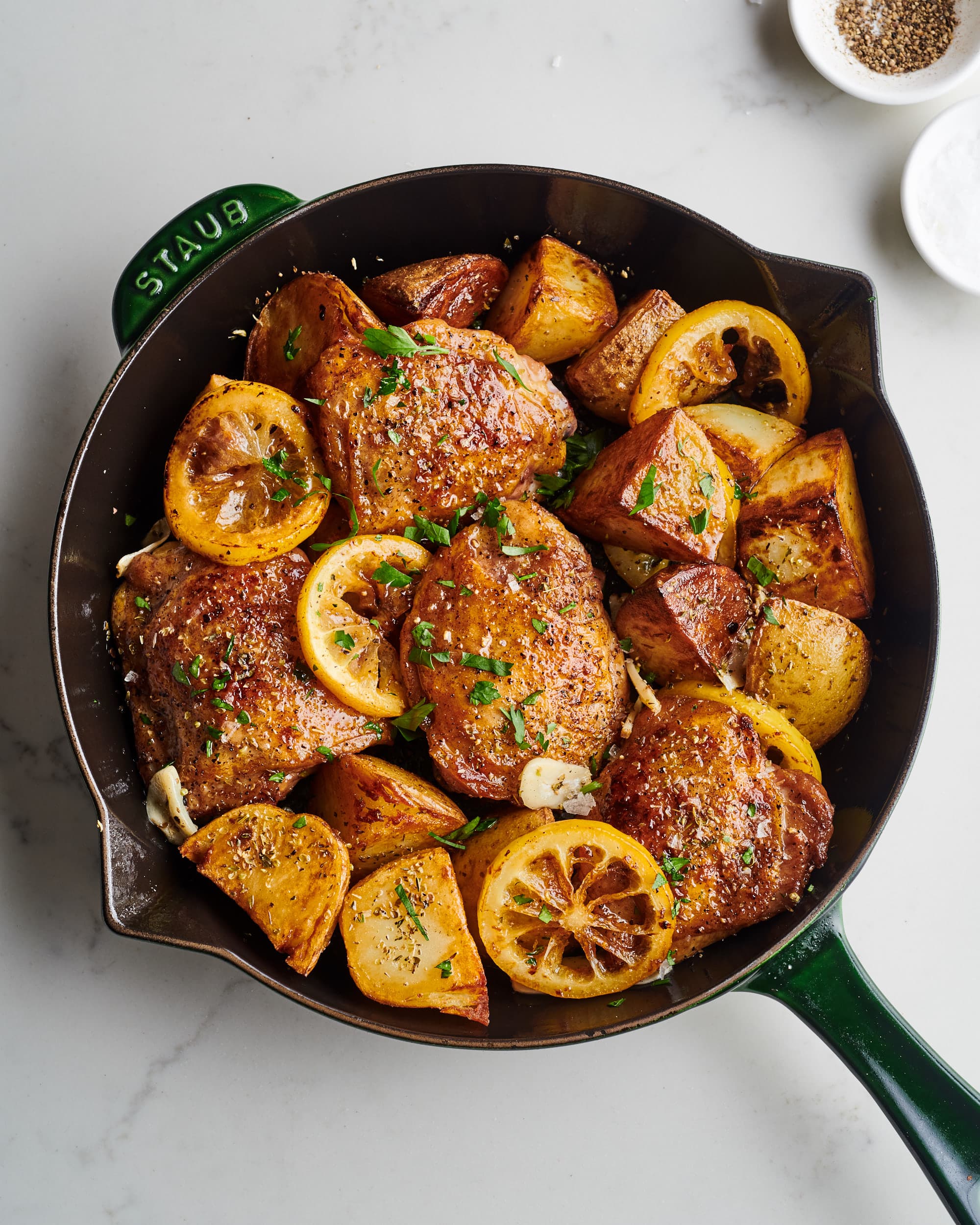 lemony chicken thighs with potatoes in a single skillet