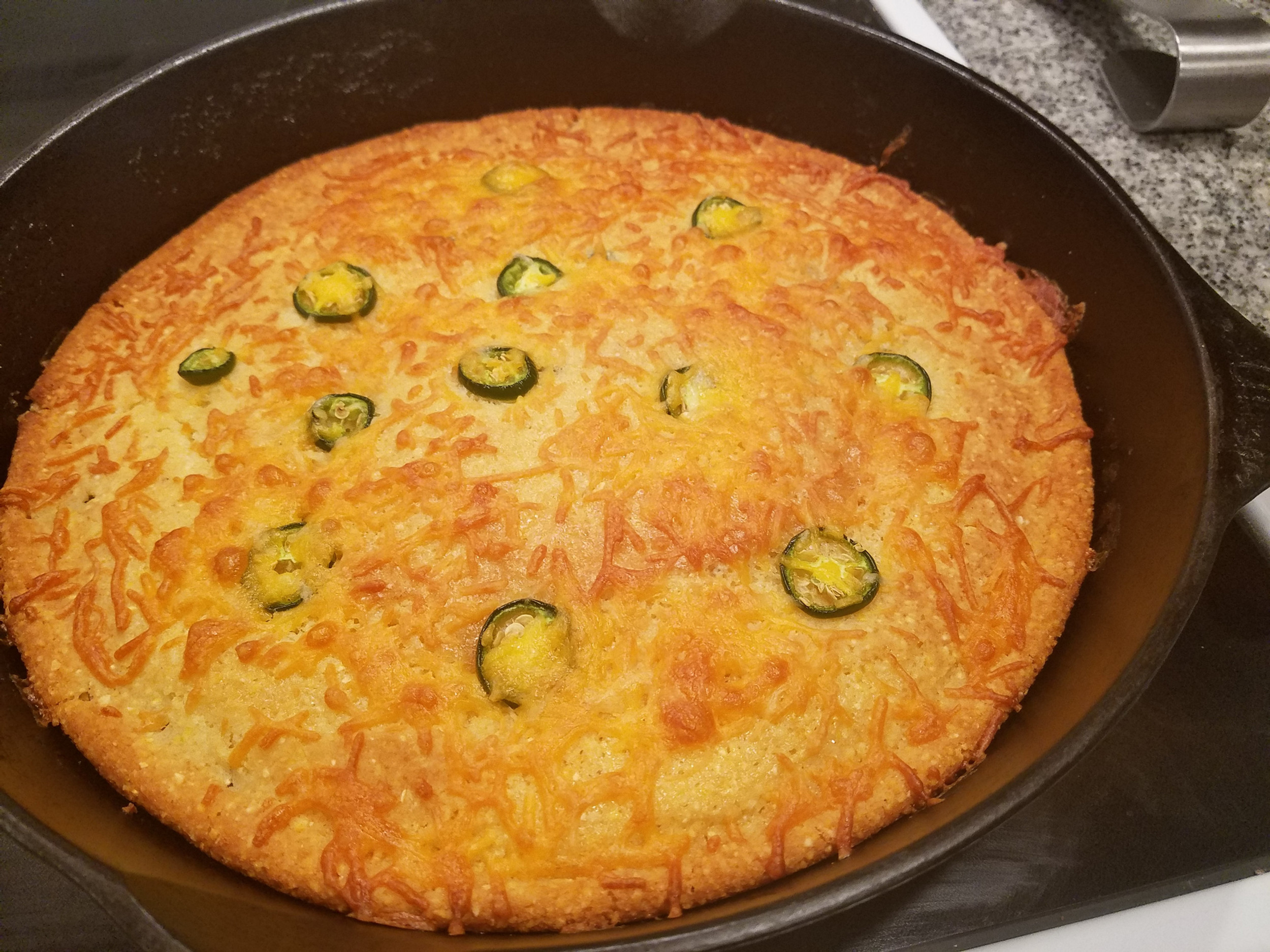 crispy jalapeno cornbread baked in a cast iron pan