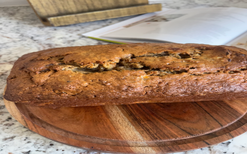 banana loaf featuring walnuts and tangy cream