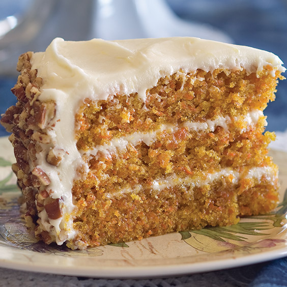 carrot cake by paula deen topped with cream cheese frosting