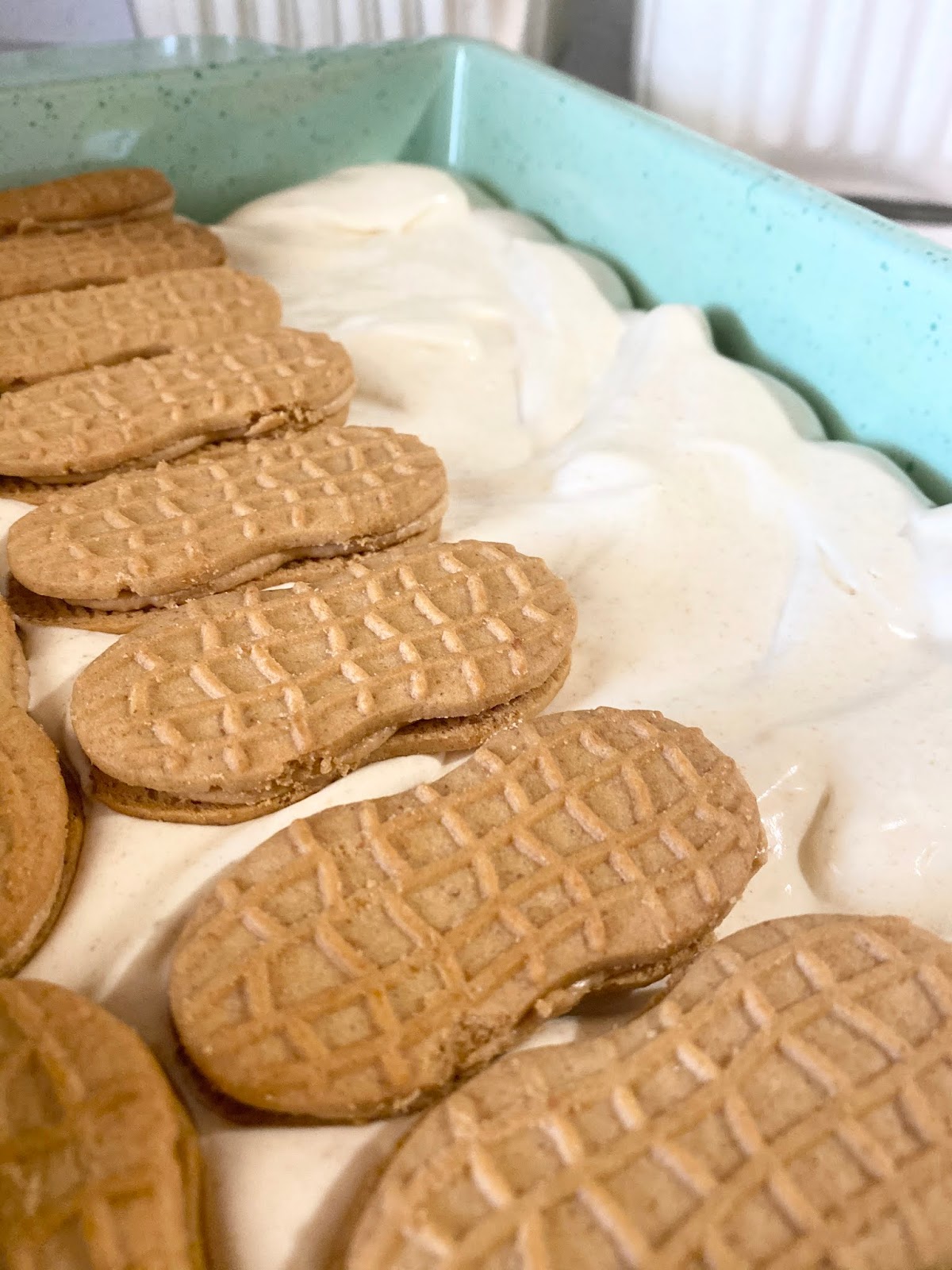layers of peanut butter delight with nutter butter cookies