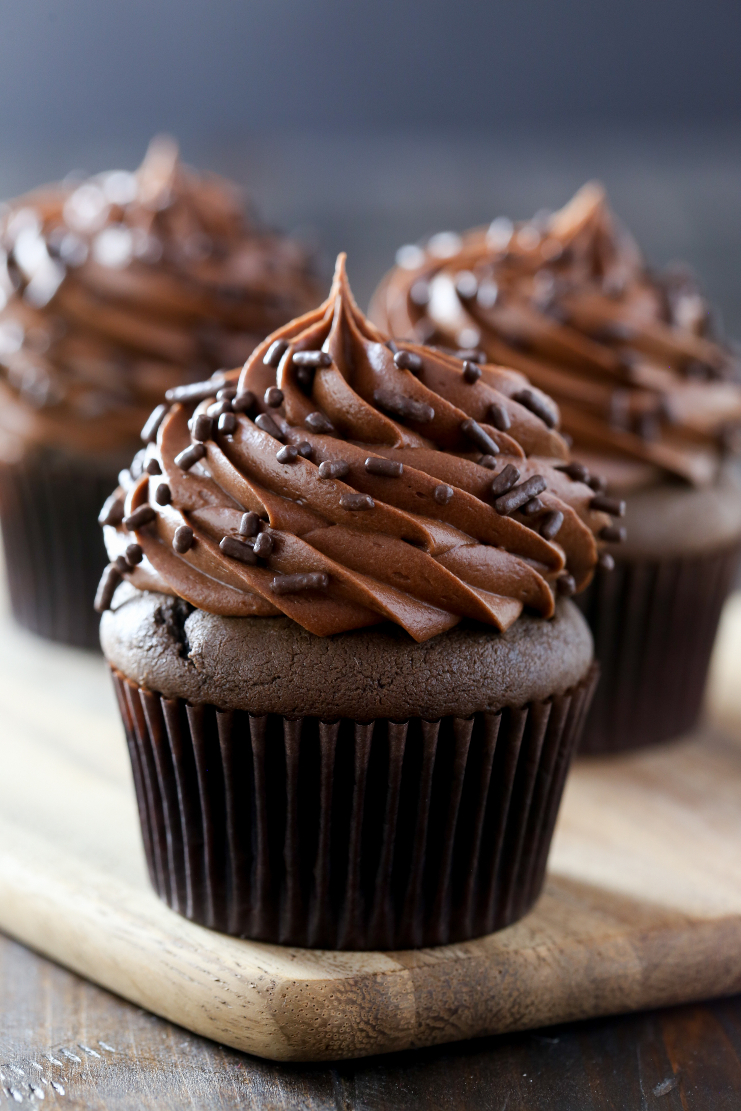 chocolate muffins topped with chocolate cream cheese icing