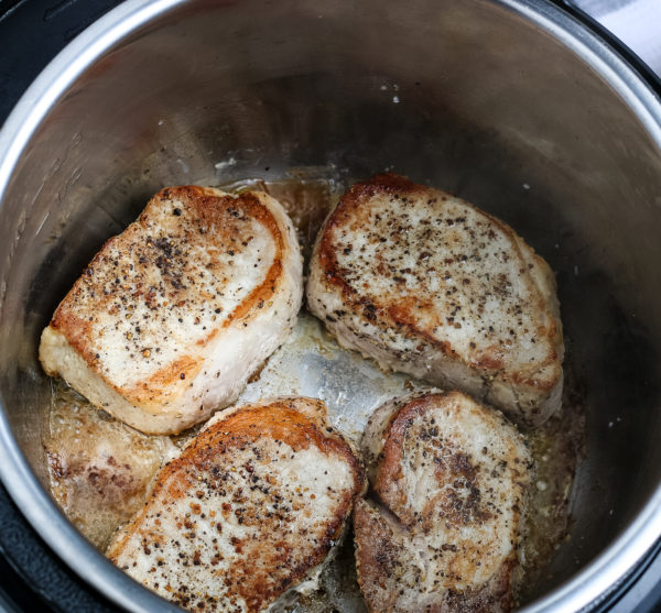 preparing pork chops using a ninja foodi pressure cooker