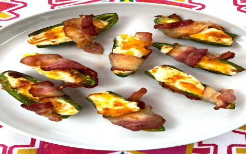 air fryer cream cheese stuffed jalapenos wrapped in bacon
