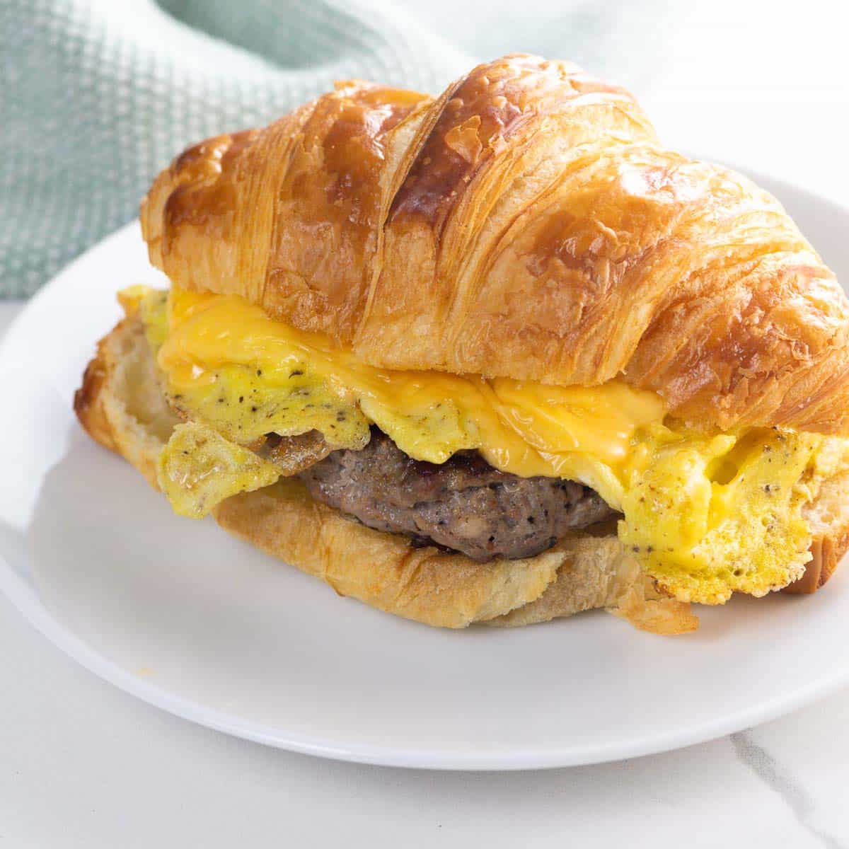 how to make a croissant with sausage, egg, and cheese